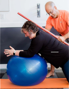 Adam-working-with-client-exercise-ball